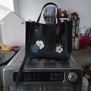 Chic Black Shoulder Bag with Floral Charms
